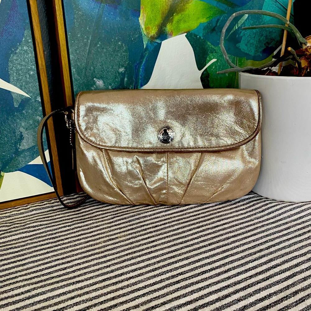 Coach wristlet. Gold-colored